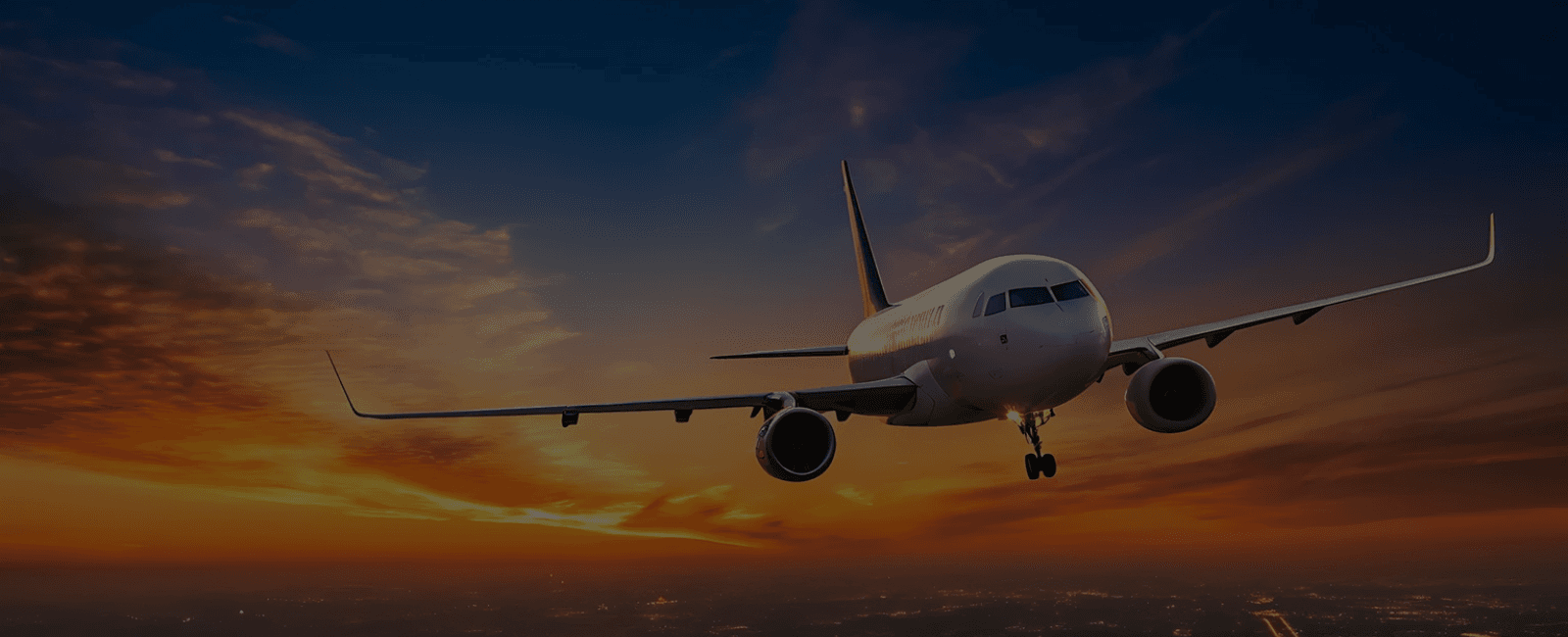 A commercial aircraft taking off head-on at sunset